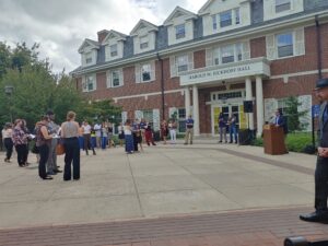 A wide view of people socializing outside of Eick.